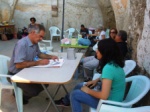 cartoonist Mustafa Tozaki doing a cartoon portrait